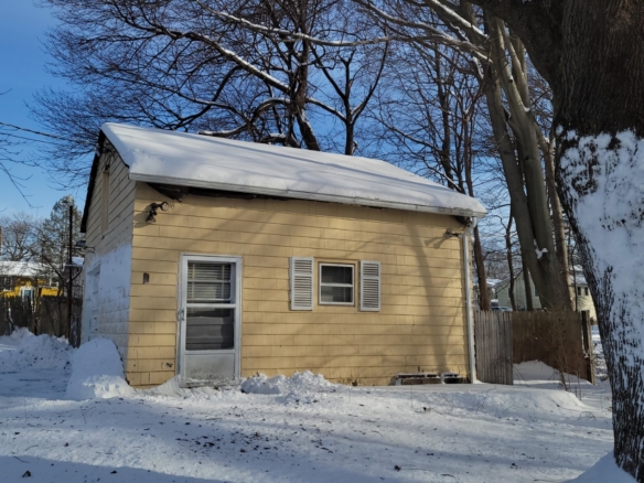 Large yellow detached storage building or workshop at 78 Summit St, Meriden, CT.