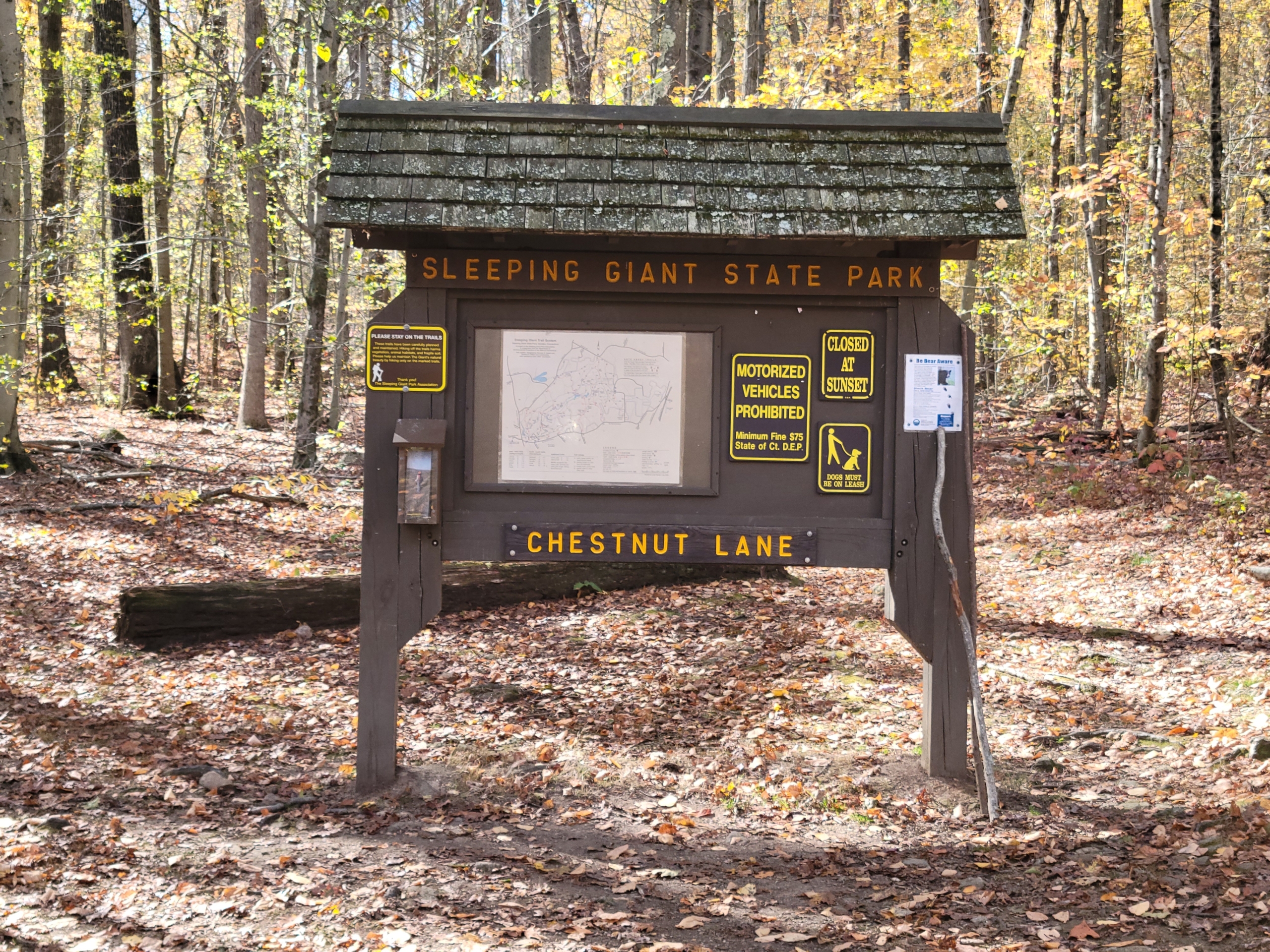 Sleeping Giant State Park trail map and sign located at the end of Chestnut Lane in Hamden, CT.