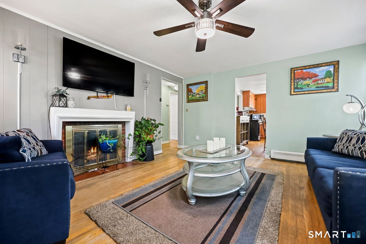 Seamless flow between the living room and dining area in a CT home.