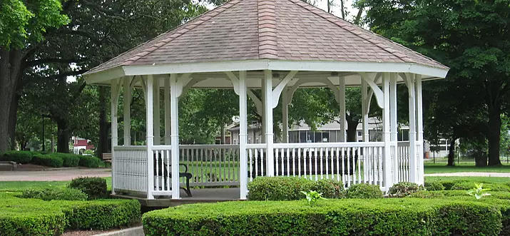 The North Haven town green has a gezebo landscraped with shrubs, flowers, and walk ways.