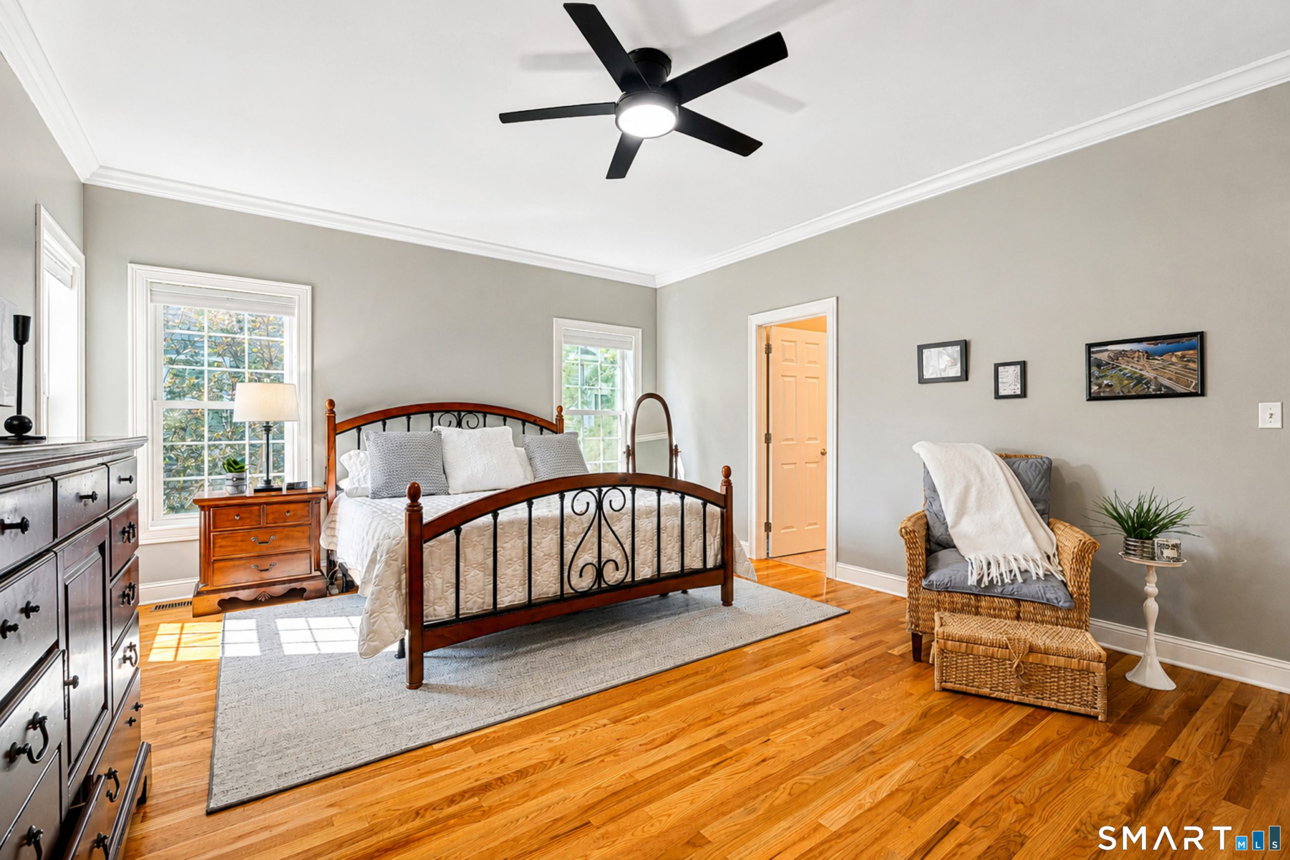 Primary bedroom at 10 Crestview Drive in Middlefield with hardwood floors and multiple windows